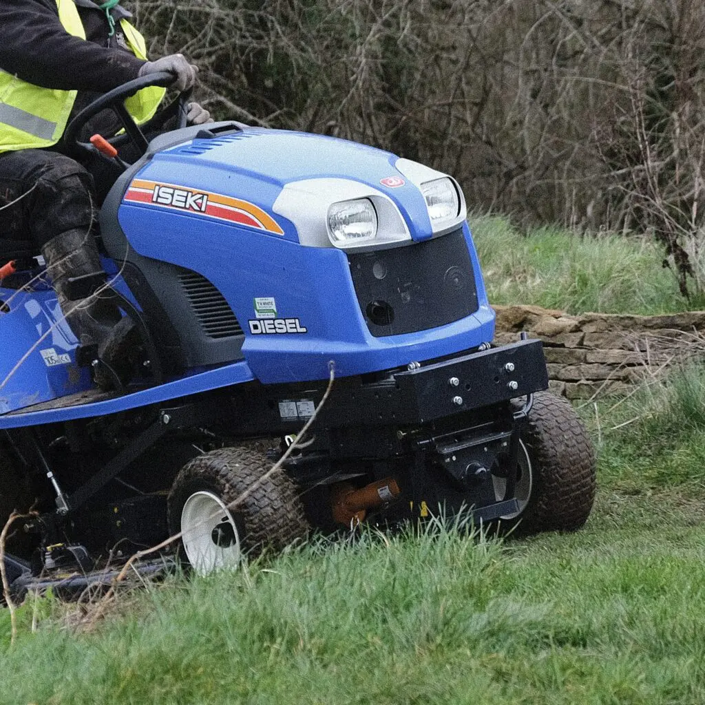 Sit on mower on the grass