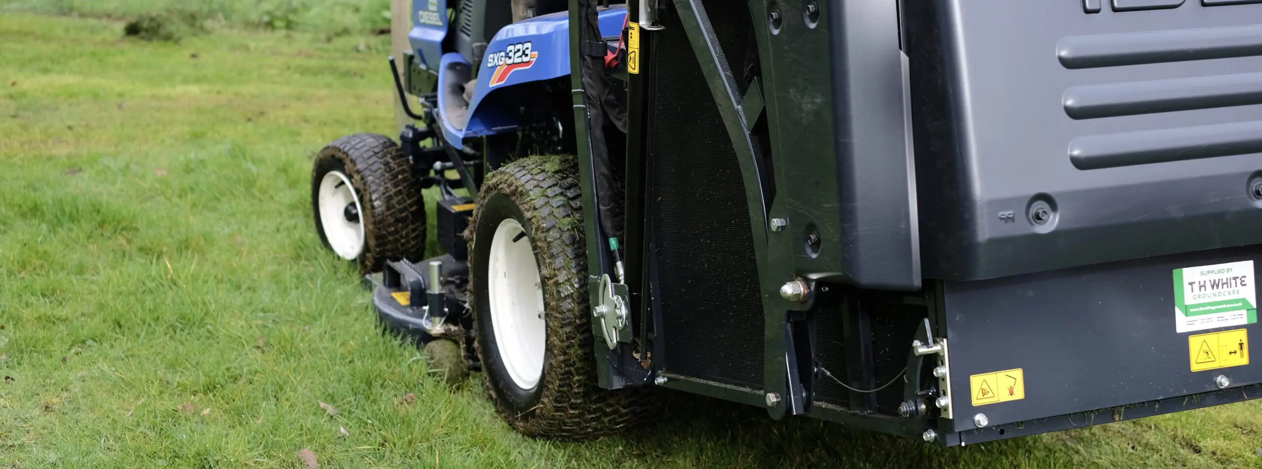 Sit on mower on the grass